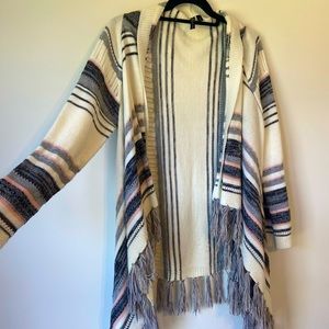 Soft cardigan-style sweater w/ fringe bottom. Size L. Cream/Grey/Pink